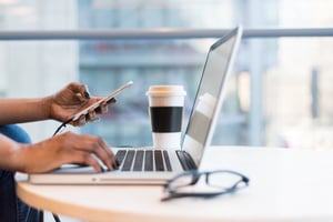 person-using-macbook-air-on-table-1181248