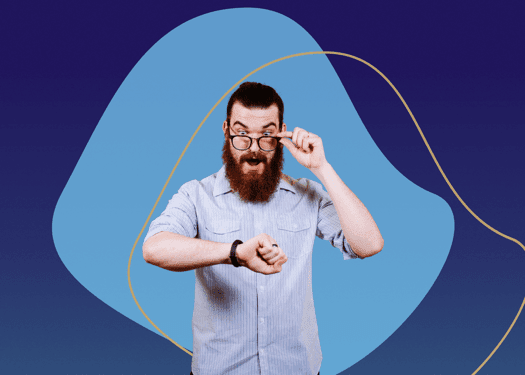 A man with a surprised look on his face while checking the time on his watch