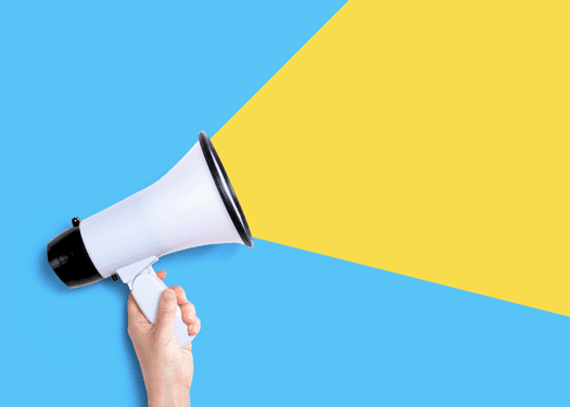 A hand holding a megaphone