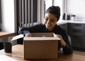 A woman opening a package