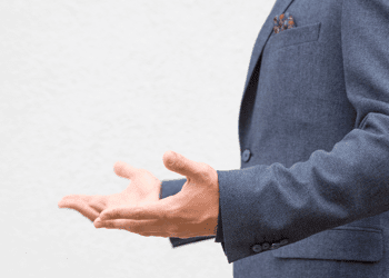 Side view of a torso with hands gestured as if questioning "why?"